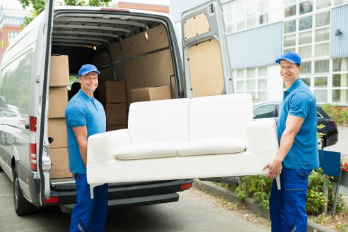Man and van moving furniture in a Harrow residential street