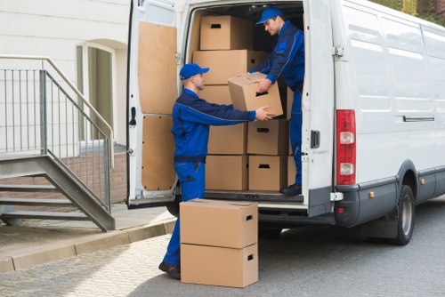 Professional house removal team working in a Harrow residential street