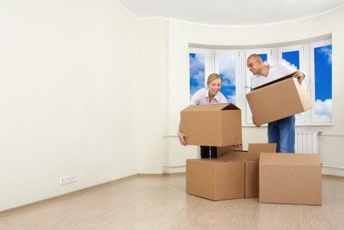 Packed moving boxes and furniture ready for transport in Harrow