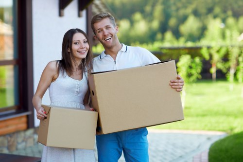 Careful loading of furniture into a moving van in Harrow