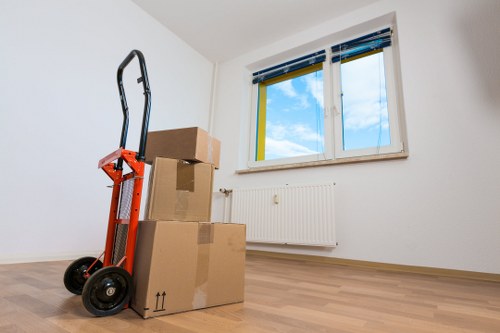 Moving team handling household items with care during a Harrow relocation