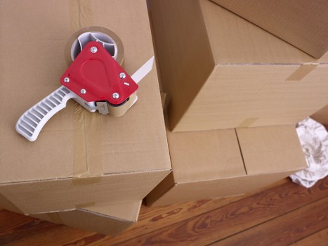 Packed moving boxes prepared for transport in Harrow