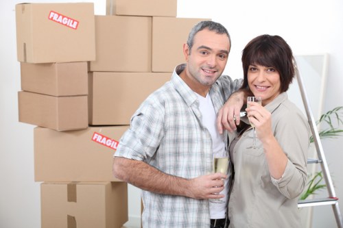Professional movers handling boxes and appliances in Harrow